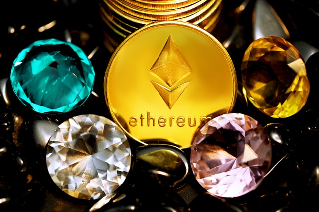 ethereum coin with gemstones around